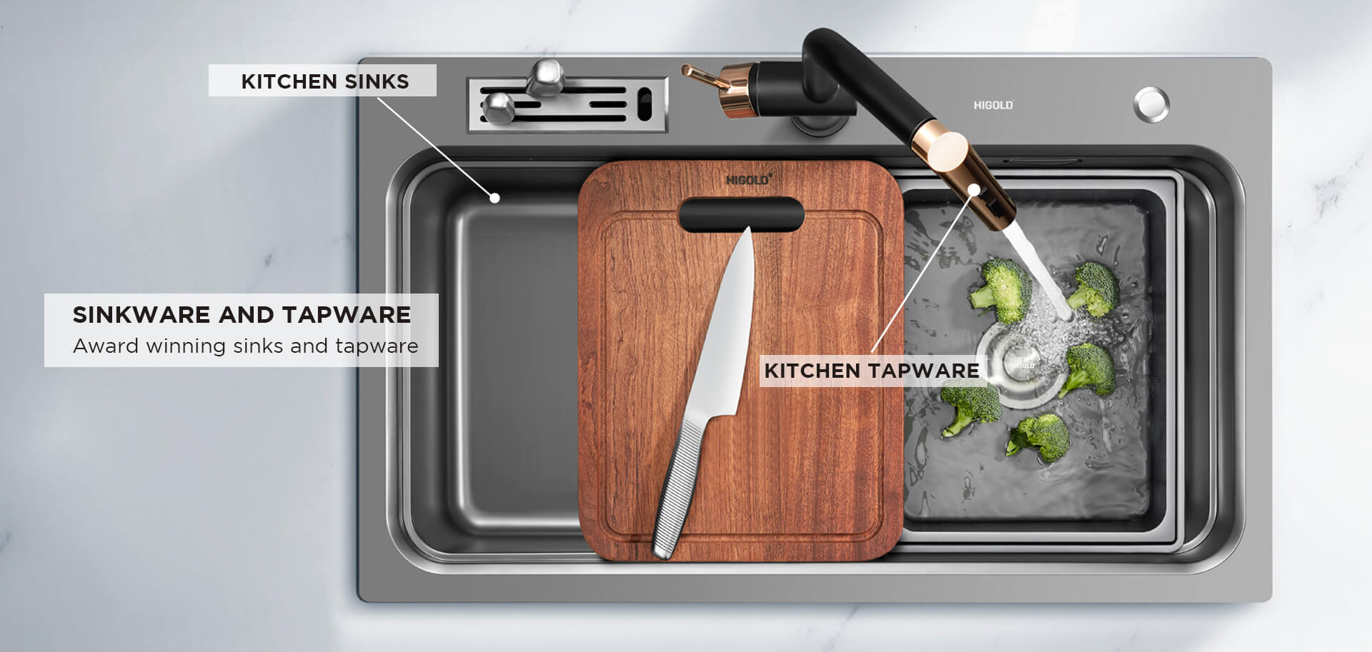 HIGOLD workstation kitchen sink installed in a dark stone benchtop with pull-out tap, slide lip accessories and chopping board